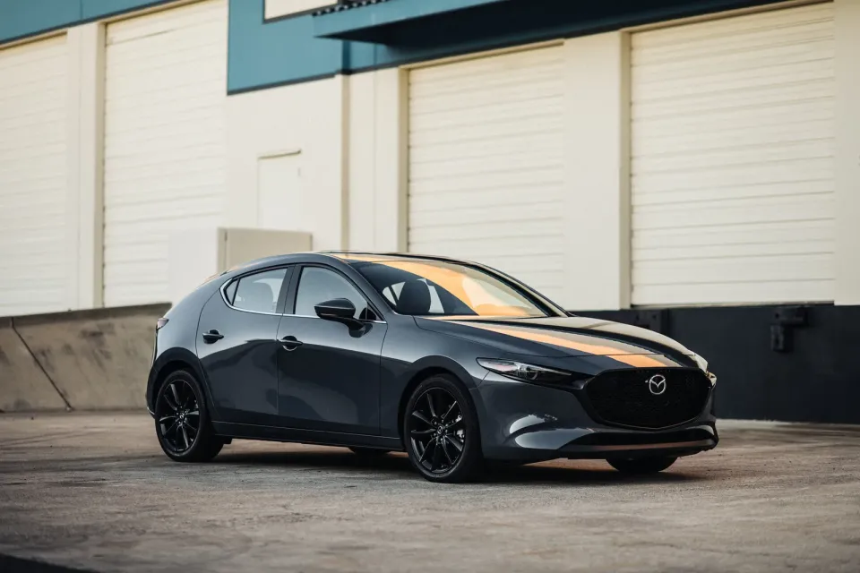 2026 Mazda3 Sport in dark grey, front three-quarter view