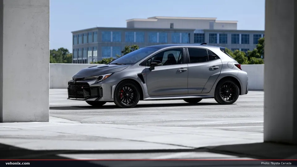 2026 Toyota GR Corolla Premium Plus in Heavy Metal grey, front three-quarter view on a rooftop