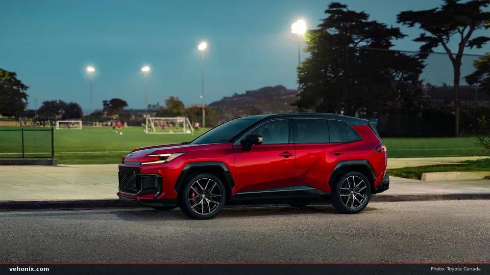 2026 Toyota RAV4 GR SPORT PHEV in red, front three-quarter view at dusk