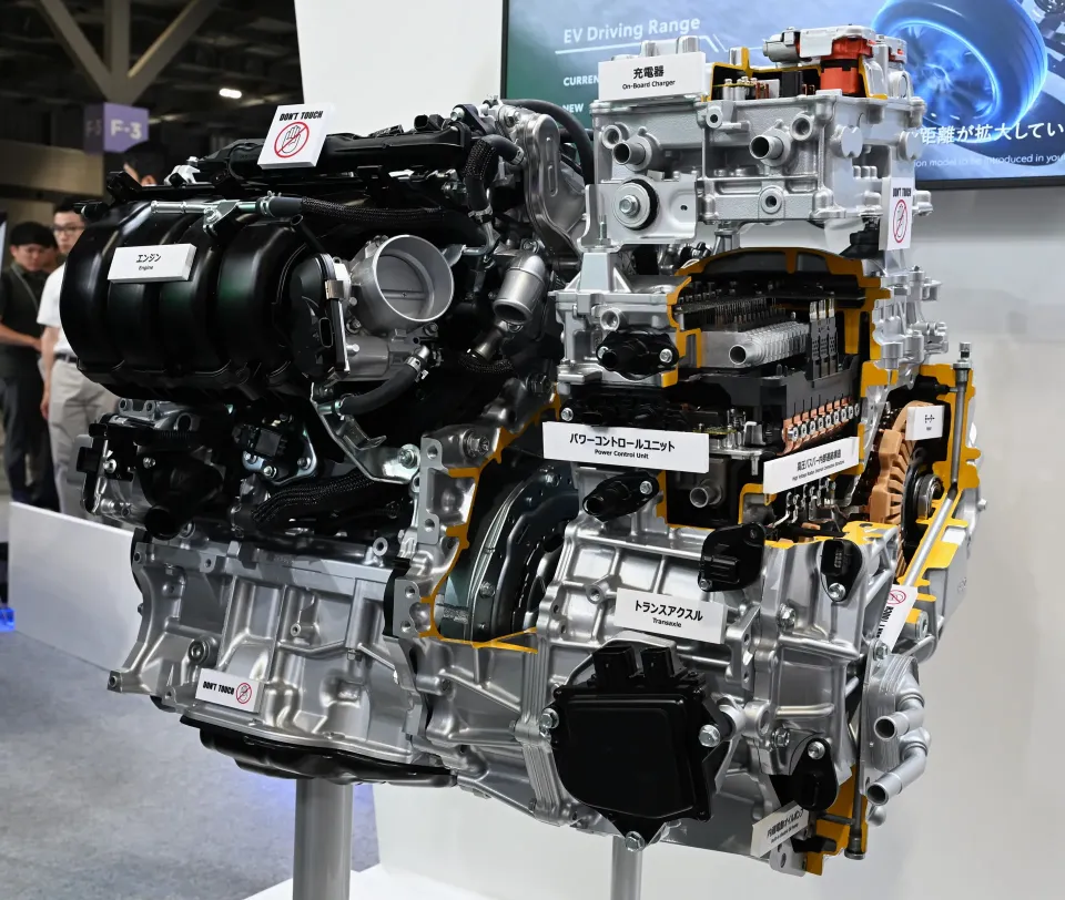 The engine and electric motor of the 2026 Toyota RAV4 plug-in hybrid system shown on display