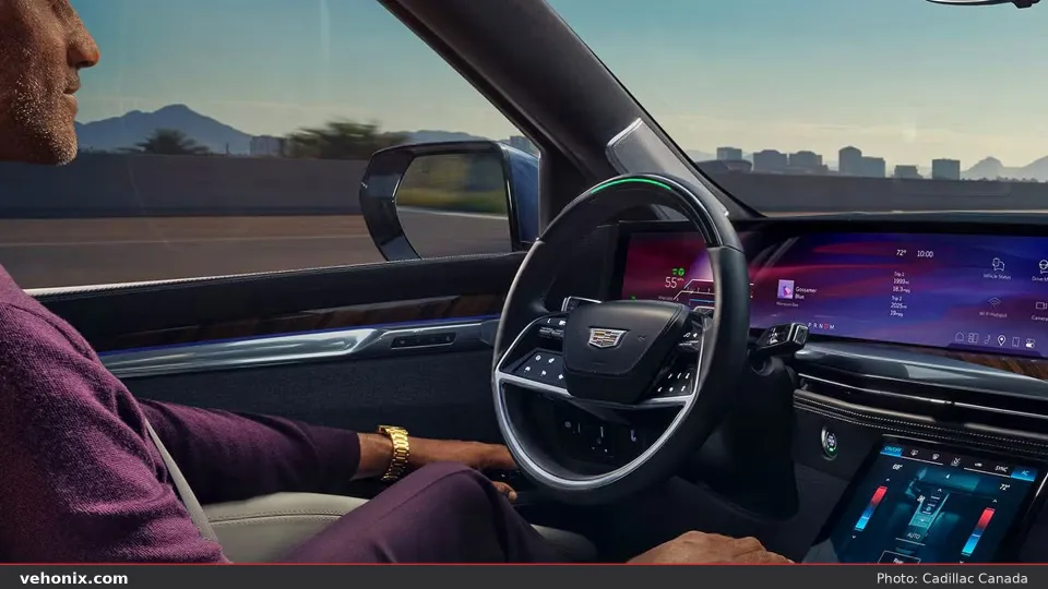 2026 Cadillac Escalade-V cabin on highway with Super Cruise light on steering wheel