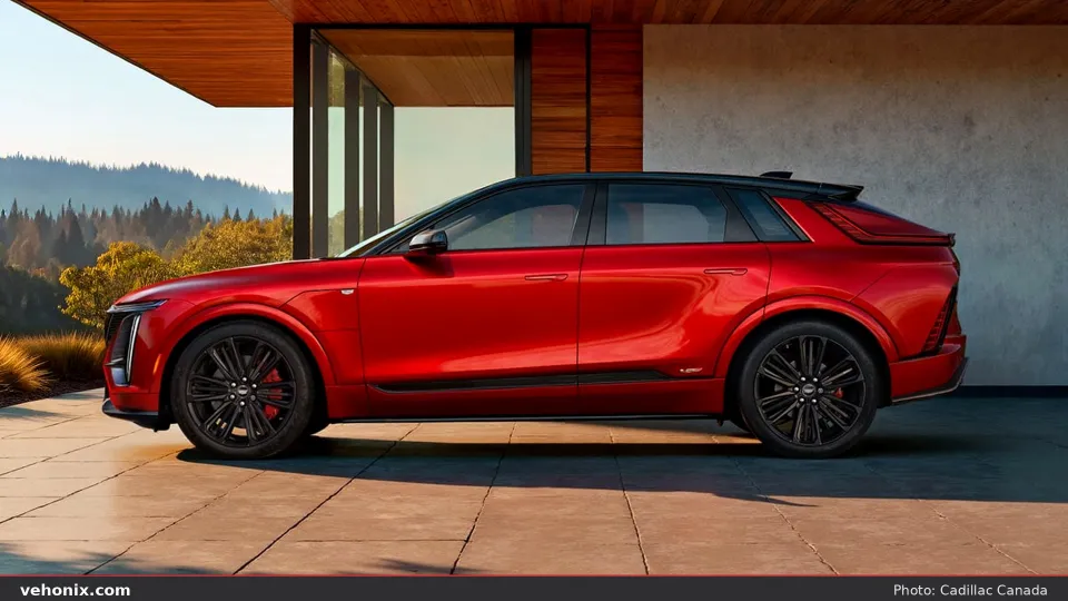 2026 Cadillac LYRIQ-V in red with black roof, full side profile on a patio