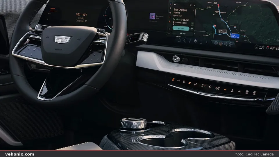 2026 Cadillac OPTIQ cockpit with curved display, climate strip and rotary controller