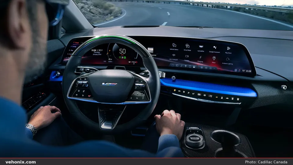 2026 Cadillac OPTIQ-V curved display cabin with Super Cruise light on the wheel