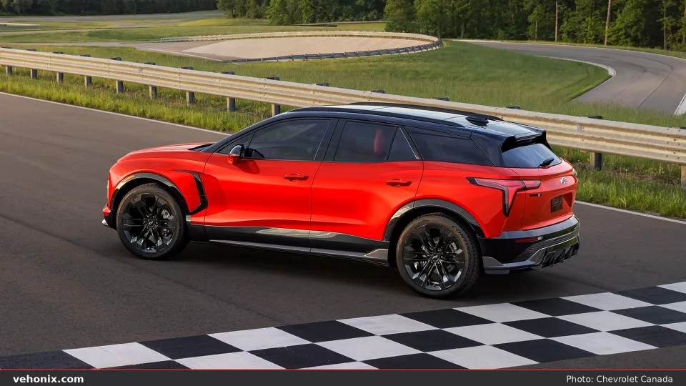 2026 Chevrolet Blazer EV in red, rear three-quarter on a racetrack
