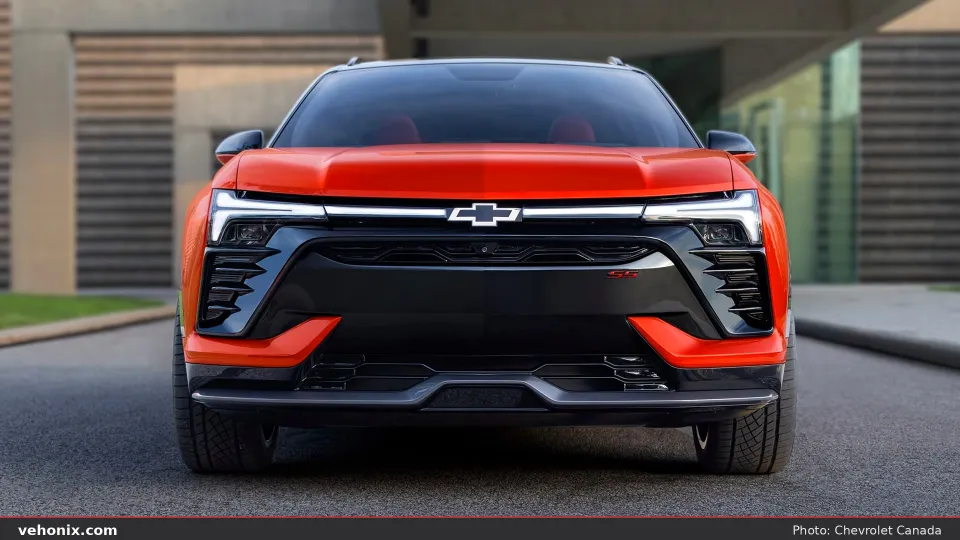 2026 Chevrolet Blazer EV front view in orange-red with full-width LED bar
