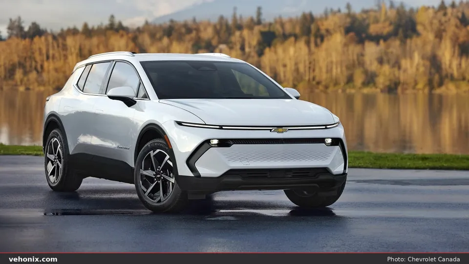 2026 Chevrolet Equinox EV in white, front three-quarter view by a lake