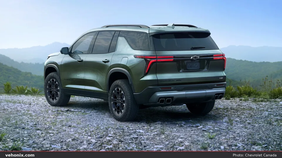 2026 Chevrolet Traverse in green, rear three-quarter view
