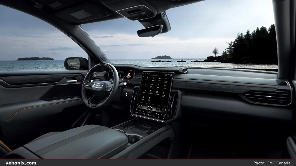 2026 GMC Acadia cabin interior looking forward through the seating rows