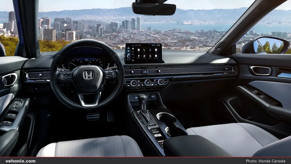 2026 Honda Civic Sport Touring Hybrid cabin with dashboard and city skyline ahead