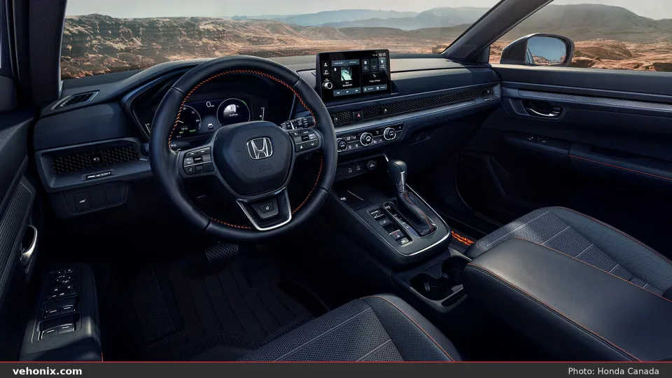 2026 Honda CR-V Hybrid cockpit with digital cluster and orange-stitched wheel