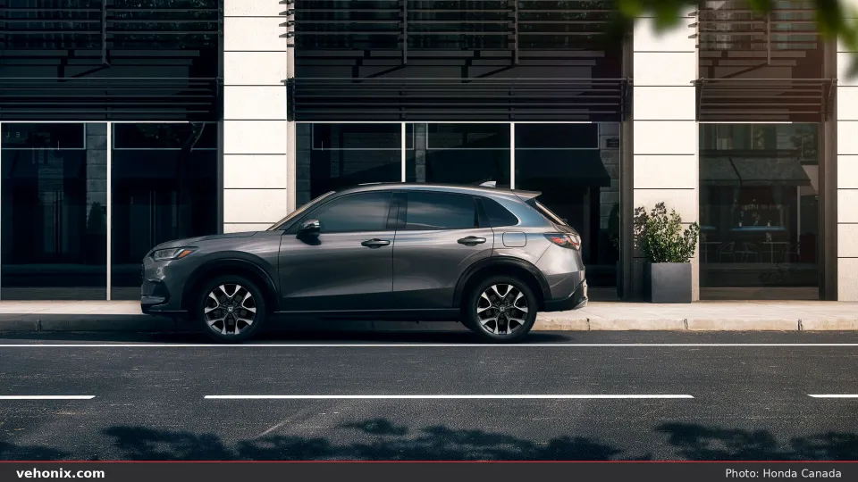 2026 Honda HR-V side profile in metallic grey parked on an urban street