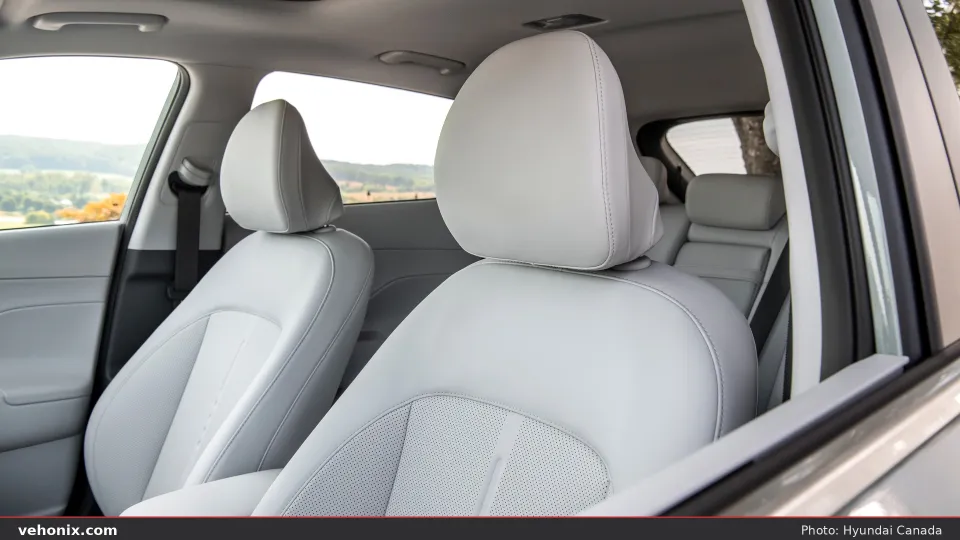 2026 Hyundai Kona light grey front seats seen through the open door