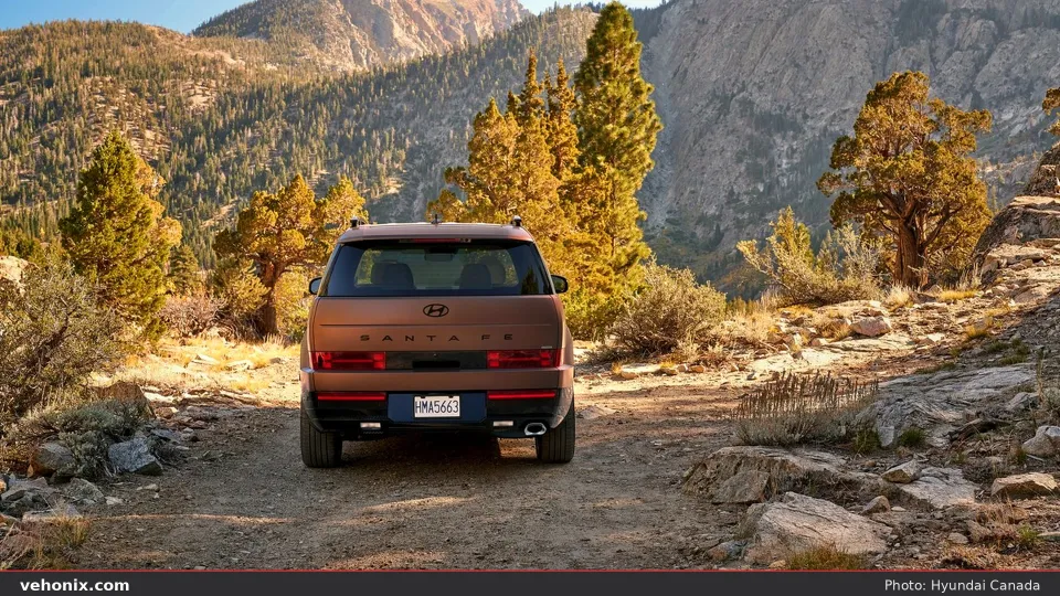 2026 Hyundai Santa Fe, side profile parked on a wooded dirt trail
