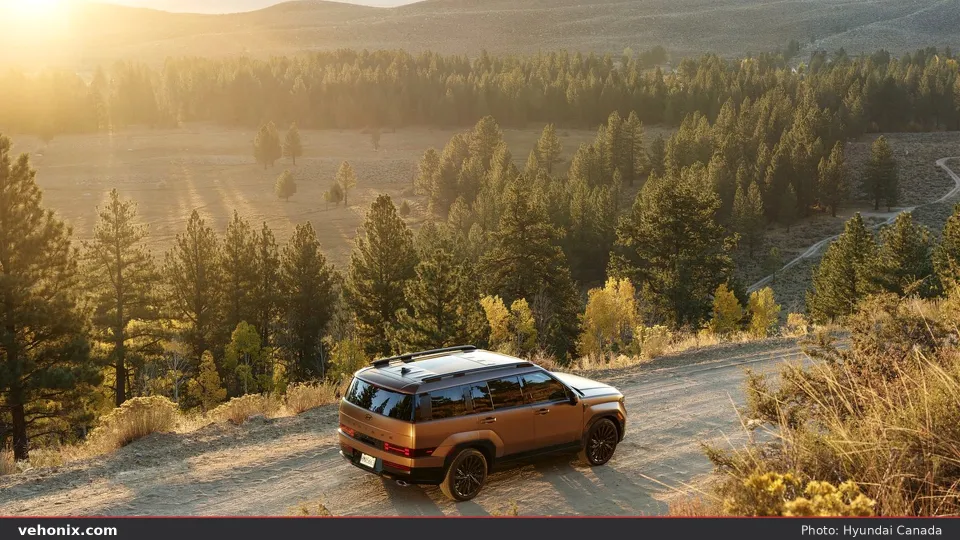 2026 Hyundai Santa Fe, rear three-quarter climbing a wooded trail