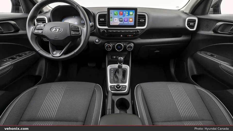 2026 Hyundai Venue dark cabin with touchscreen and climate dials