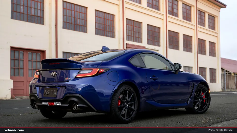 2026 Toyota GR86 Premium in Trueno Blue, rear three-quarter view with rear wing