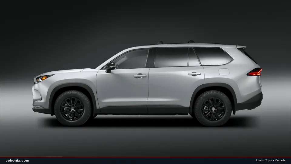 2026 Toyota Grand Highlander Woodland in silver, side profile studio view