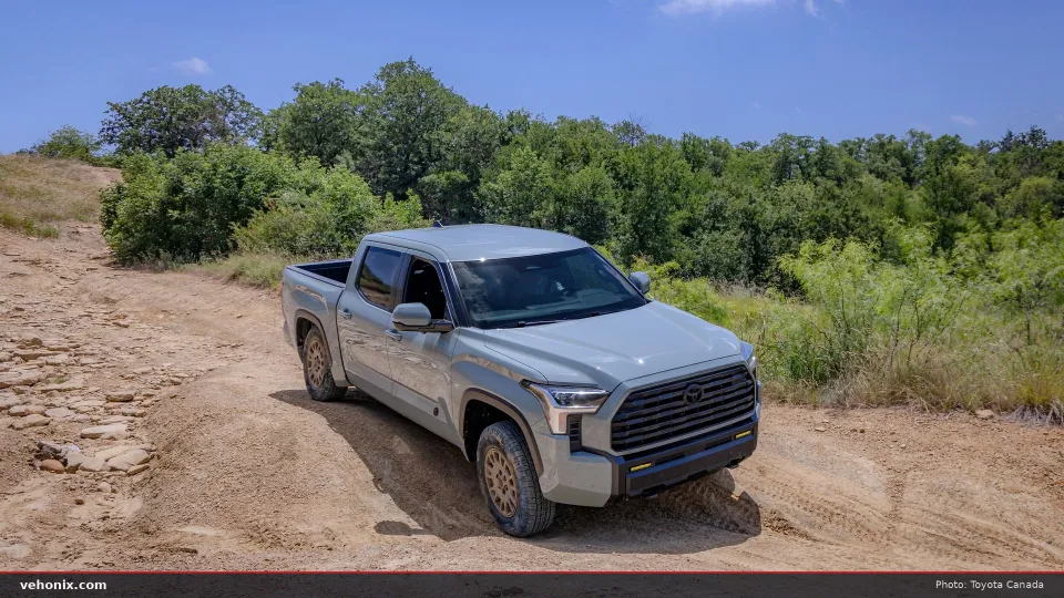 2026 Toyota Tundra Trailhunter in grey, front three-quarter view on a dirt trail