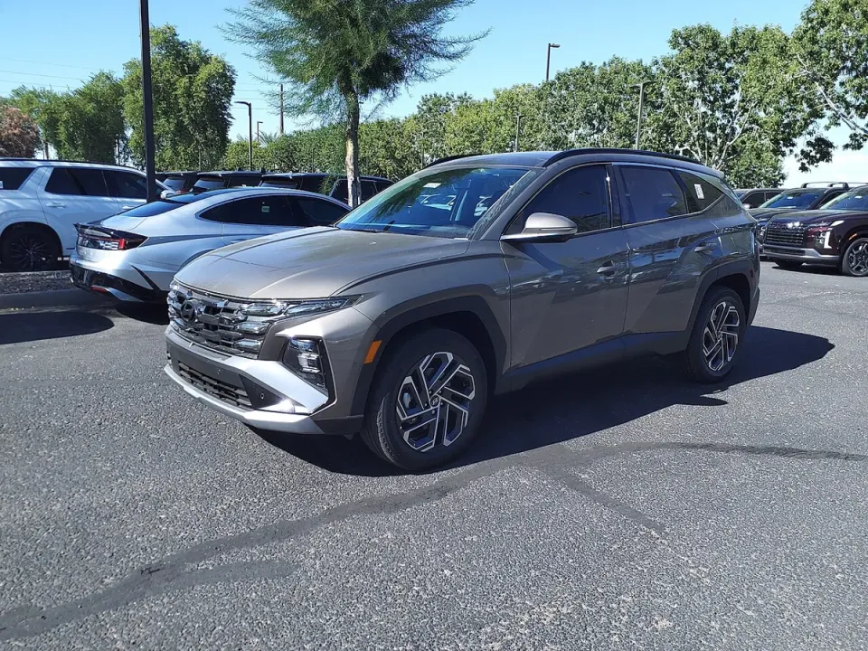 A grey Hyundai Tucson Hybrid parked in a lot