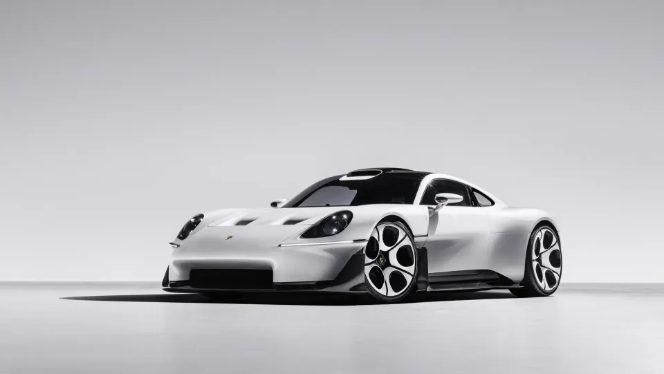 A white Porsche Mission S concept car seen from the front left in a studio