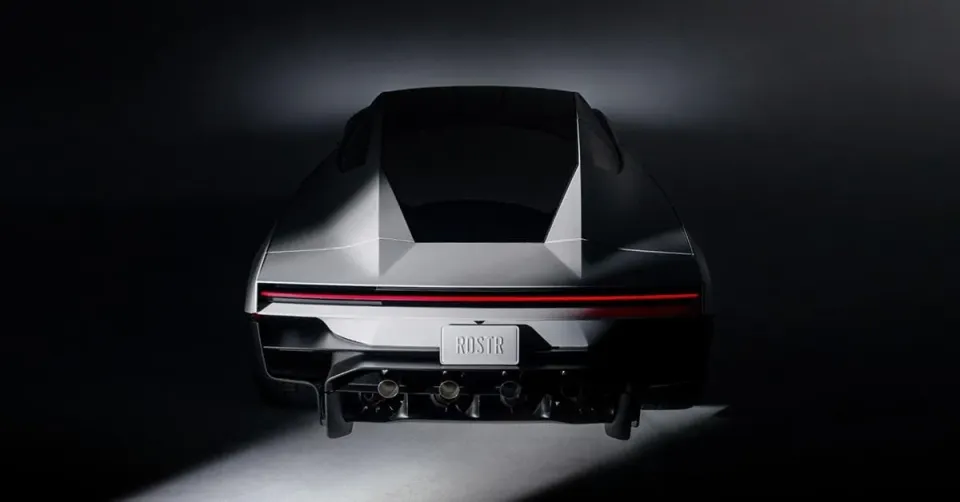The rear of a grey Tesla Roadster with a thin red light bar and a licence plate that reads ROSTR